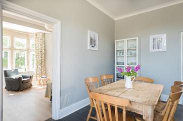 Walk through from the sitting-room to the dining-room.