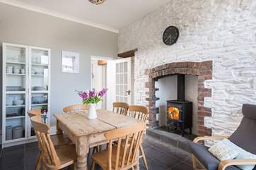 A wood-burner in the dining-room.