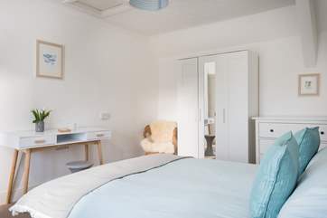 Plenty of space in Bedroom 1 for a cot.