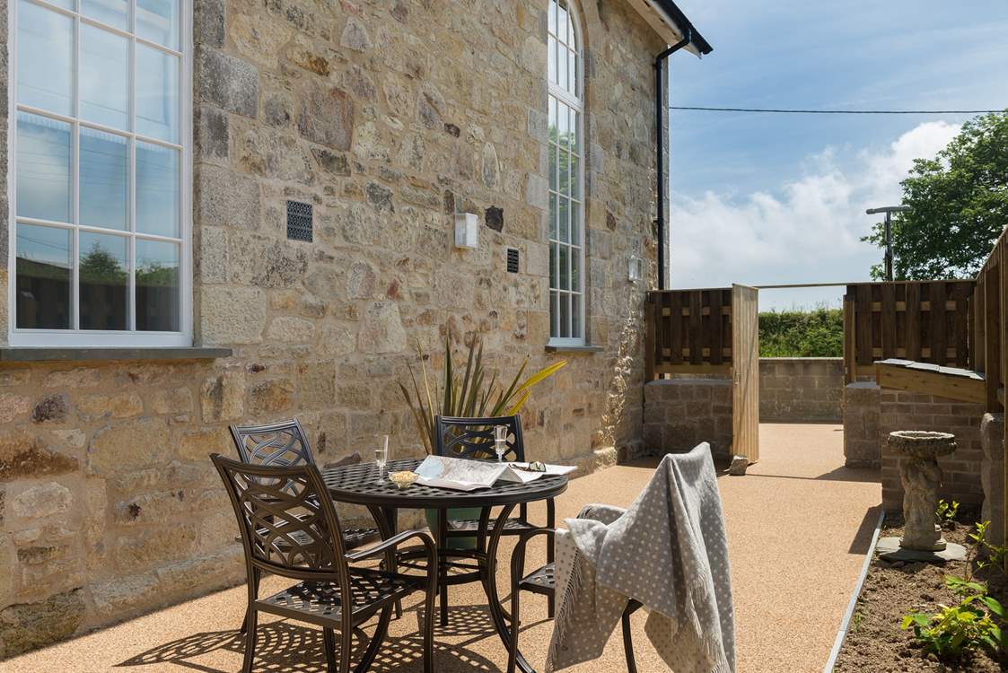A tucked-away spot for morning coffee and evening meals on summer days.