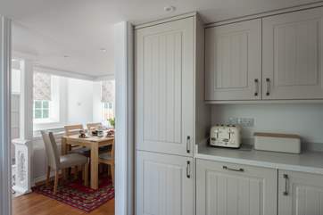 The kitchen is adjacent to the dining-area.