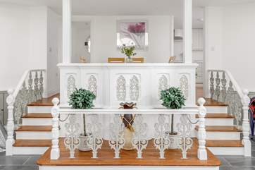 This characterful abode has some fabulous original features including these filigree railings.