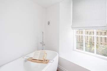 The family bathroom has a gorgeous free standing bath.