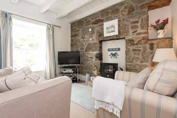 The sitting-room has a wood-burner effect electric stove.
