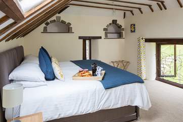 The master bedroom boasts delightful features from the original linhay days.
