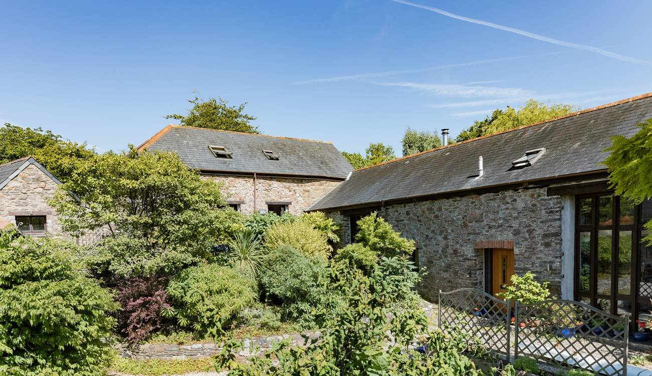 Laurel Cottage (situated to the left) through the beautiful greenery.