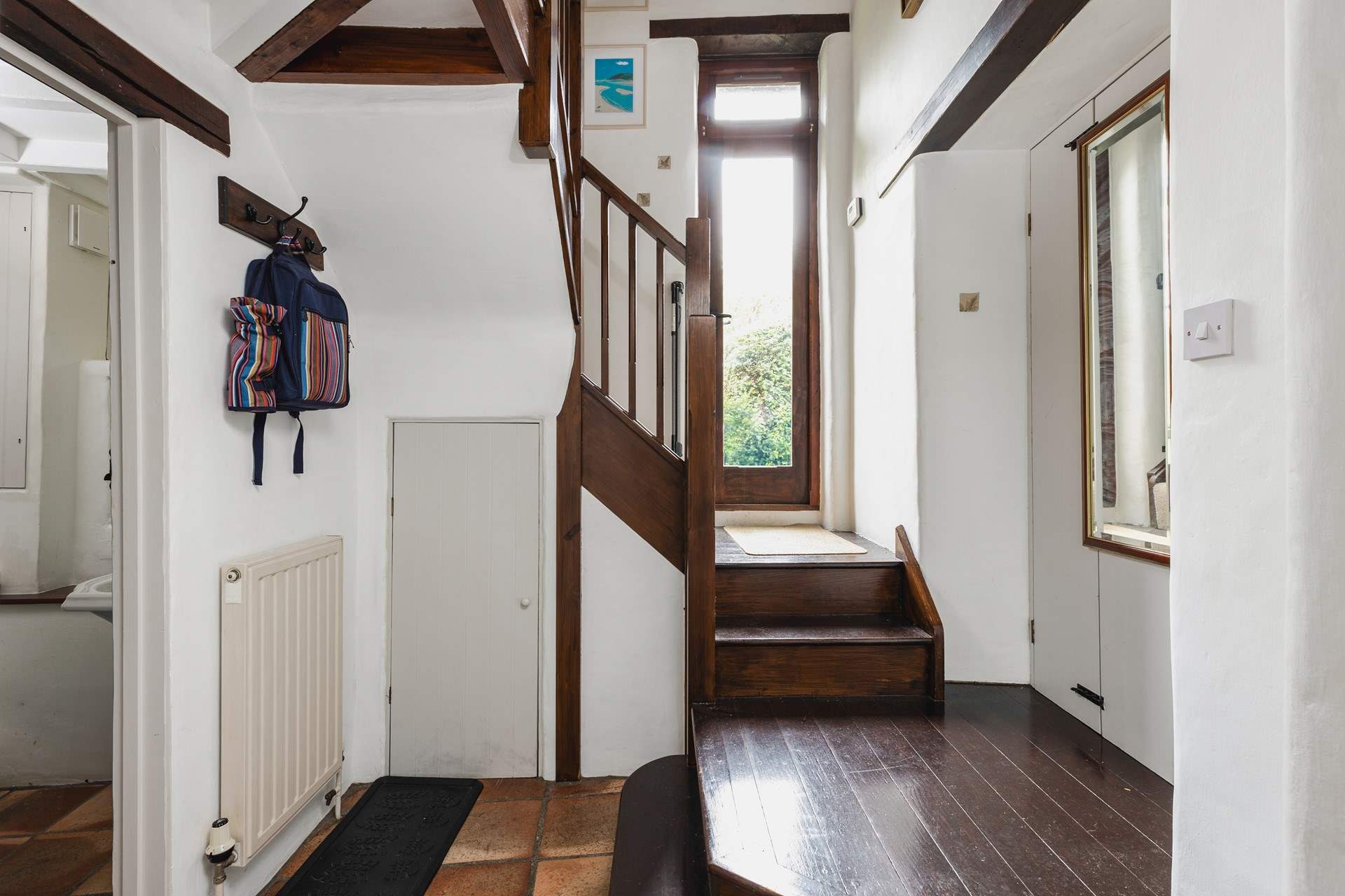 Step through this door into your fully enclosed, lovingly maintained garden.