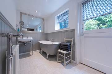 The gorgeous bathroom with a large walk-in shower at the other end of this picture.
