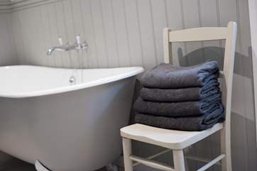 Quality linens and fluffy towels are provided.