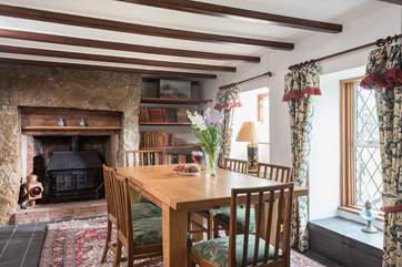 The dining-room has a library full of interesting books and a feature/ornamental fireplace (not a working wood-burner).
