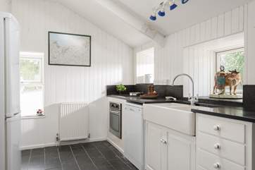 The well-equipped kitchen. Please note that there is a step down into the sitting-room.