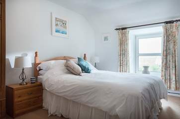 The second bedroom has a king-size bed.