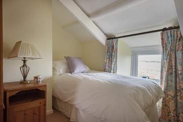 This bed has sea views from the little window.