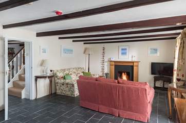 The sitting-room is between the dining-room and the conservatory.