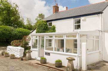 This delightful farmhouse sits across the courtyard from the owner's home and small-holding.