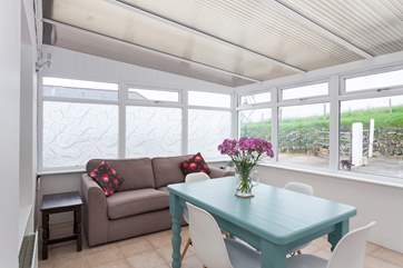 The bright conservatory is a fabulous place to relax in.