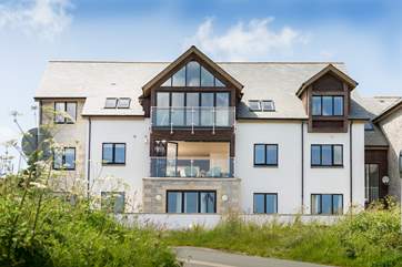 There are only eight apartments in the building making them rather exclusive. The apartment is on the first floor, in the middle of the photo with the windows open).