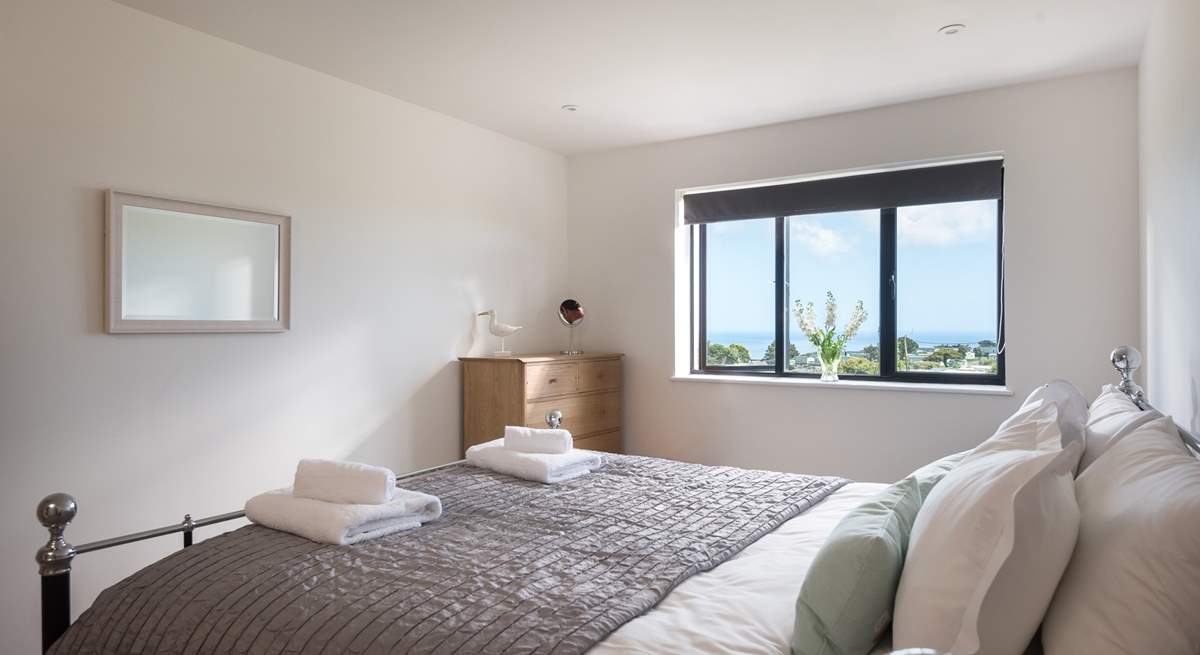 The main bedroom also shares those wonderful sea views and has an en suite shower-room.