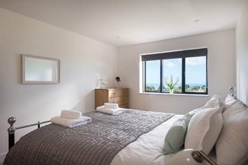 The main bedroom also shares those wonderful sea views and has an en suite shower-room.