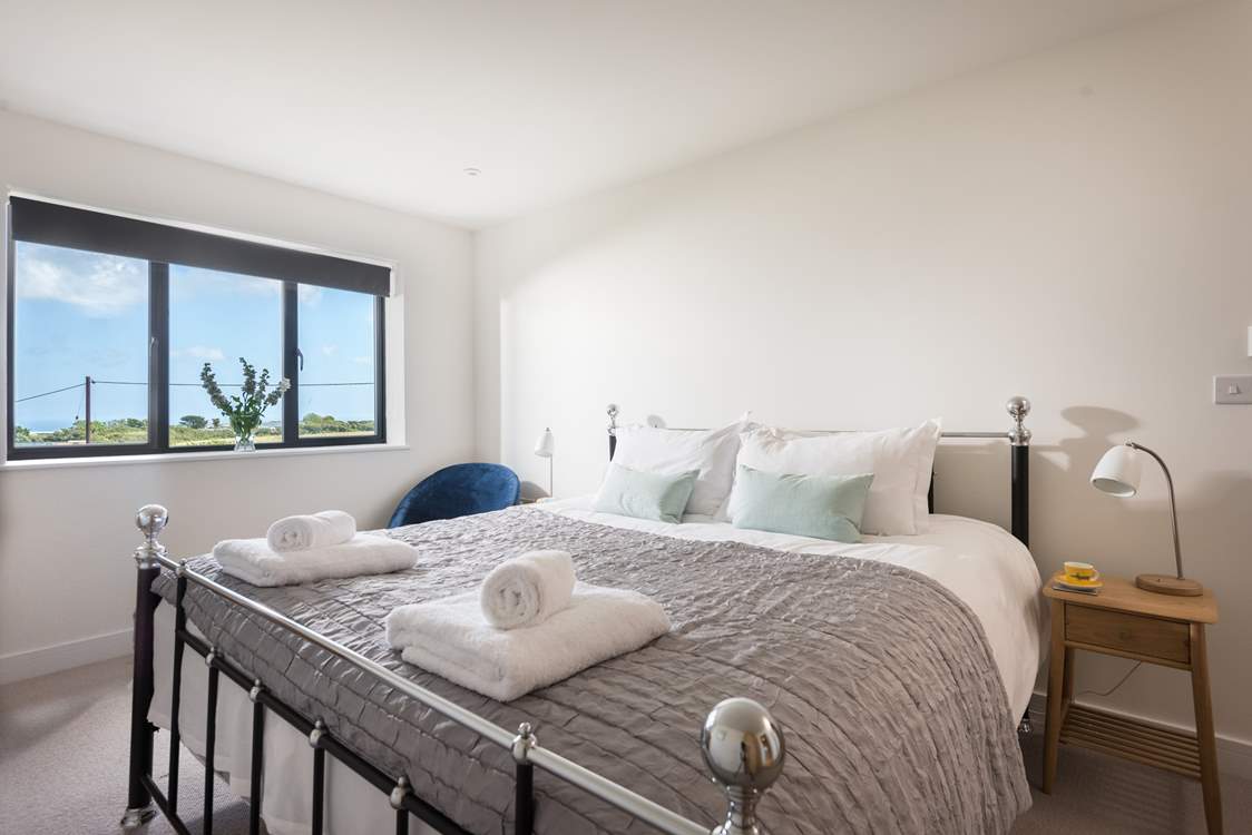 The gorgeous king-size bed with fresh cotton sheets and white fluffy towels awaits you.