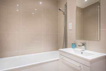 The family bathroom is located opposite bedroom 2.