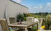 In the shared courtyard there is a table and chairs, bench seat and washing line for guests' use. - Thumbnail Image