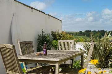 In the shared courtyard there is a table and chairs, bench seat and washing line for guests' use.