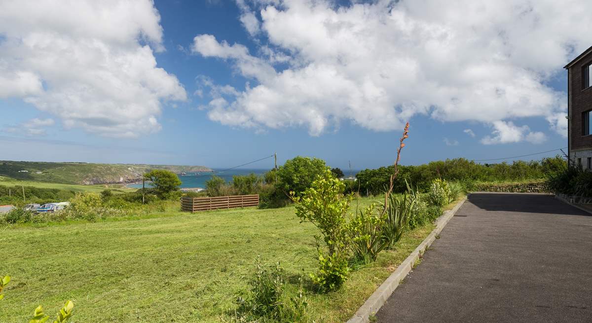 There is a shared lawn next to the building, a perfect spot for relaxation and playtime.