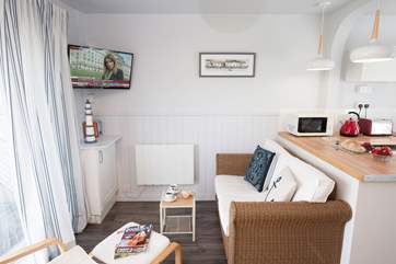 On a warm summer day, open up the patio doors in the sitting-room and relax.