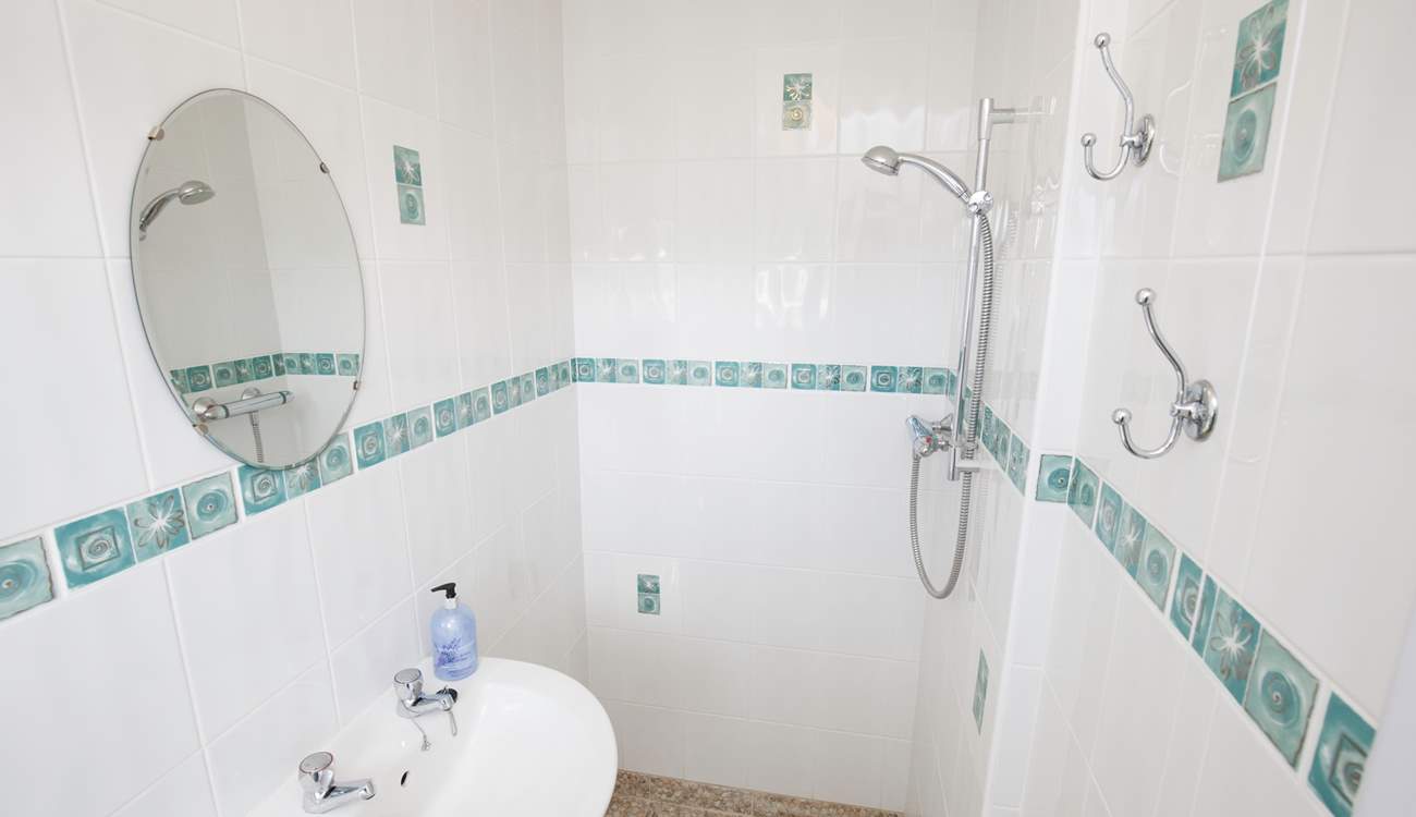 After creating footprints on the sand, wash it away from inbetween your toes in the walk-in shower.