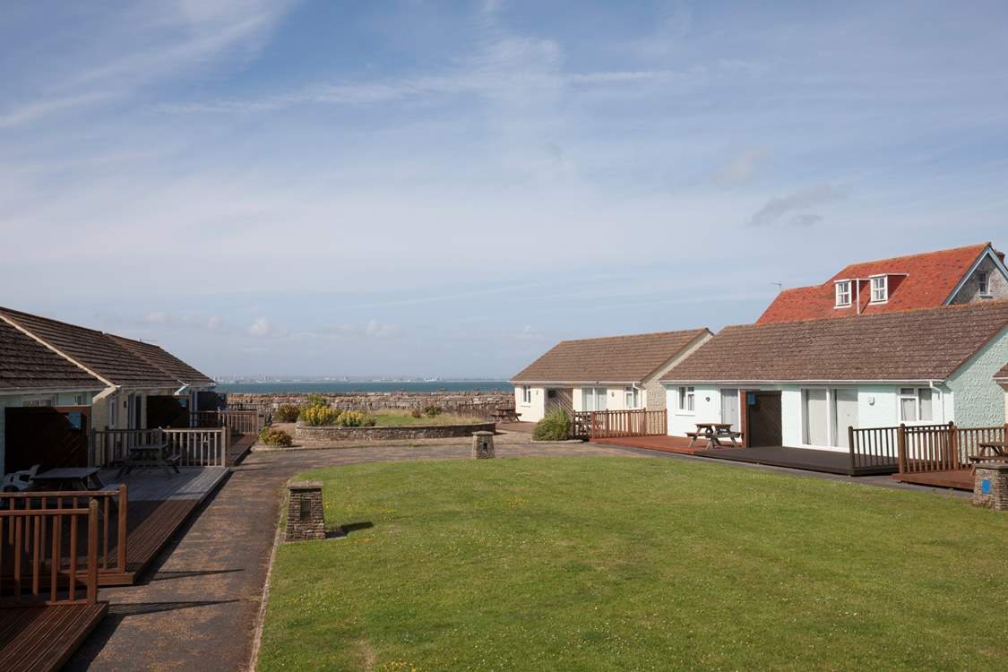 To the back of Cockleshells is a shared lawn-area which is a great space for children and dogs to run around.