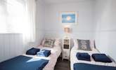 The delightful twin bedroom has views of the Hersey Nature Reserve, perfect for children. - Thumbnail Image