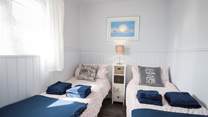 The delightful twin bedroom has views of the Hersey Nature Reserve, perfect for children.