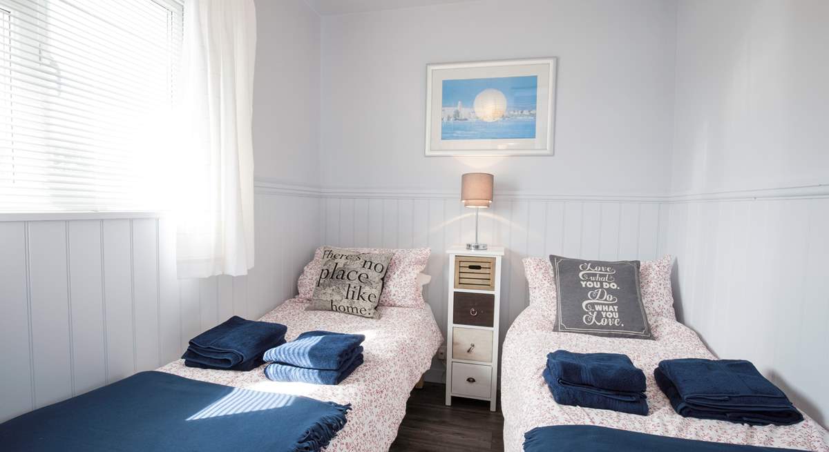 The delightful twin bedroom has views of the Hersey Nature Reserve, perfect for children.