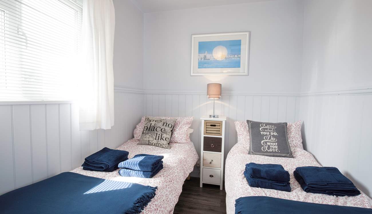 The delightful twin bedroom has views of the Hersey Nature Reserve, perfect for children.