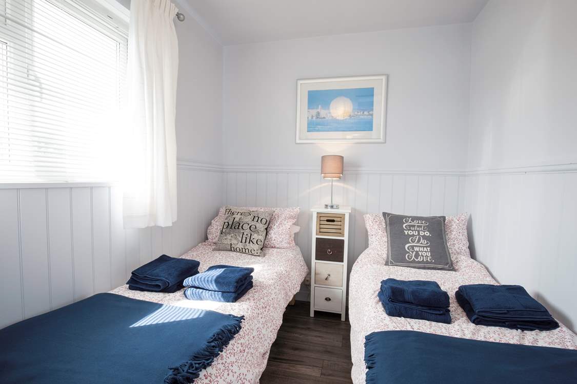 The delightful twin bedroom has views of the Hersey Nature Reserve, perfect for children.