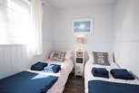The delightful twin bedroom has views of the Hersey Nature Reserve, perfect for children.
