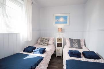 The delightful twin bedroom has views of the Hersey Nature Reserve, perfect for children.