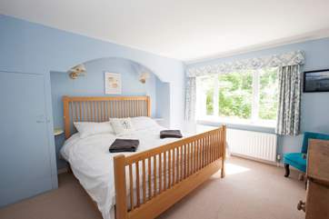 On the ground floor is a double bedroom with views out to the mature back garden.