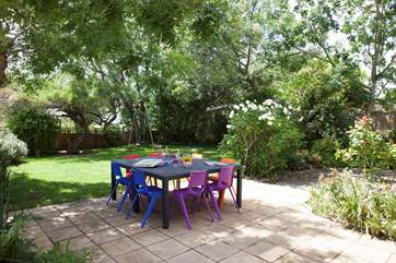 The lovely garden with seating for eight.