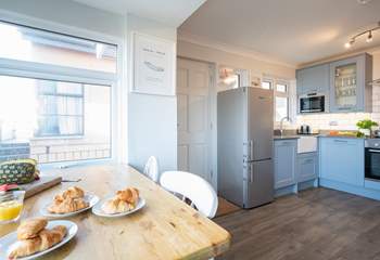 Enjoy your morning breakfast whilst glazing out at sea views in the  modern style kitchen/breakfast-room.