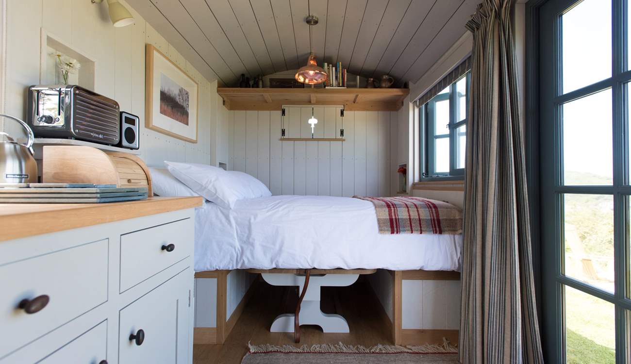 The cleverly-designed double bed converts with ease from the dining table and benches.