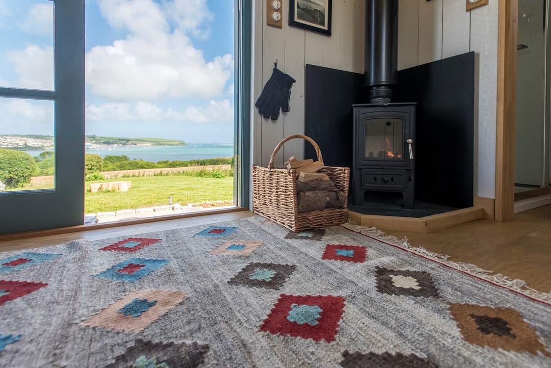 As well as the toasty wood-burner, an electric panel heater is provided.
