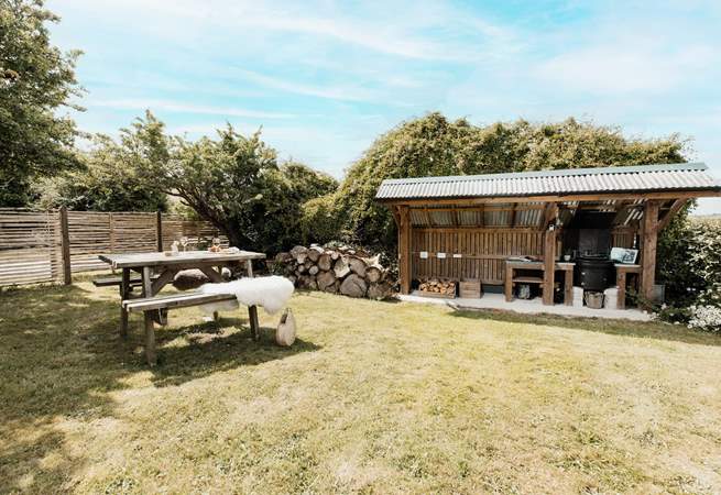 The covered BBQ hut is perfect for those evening delights. 