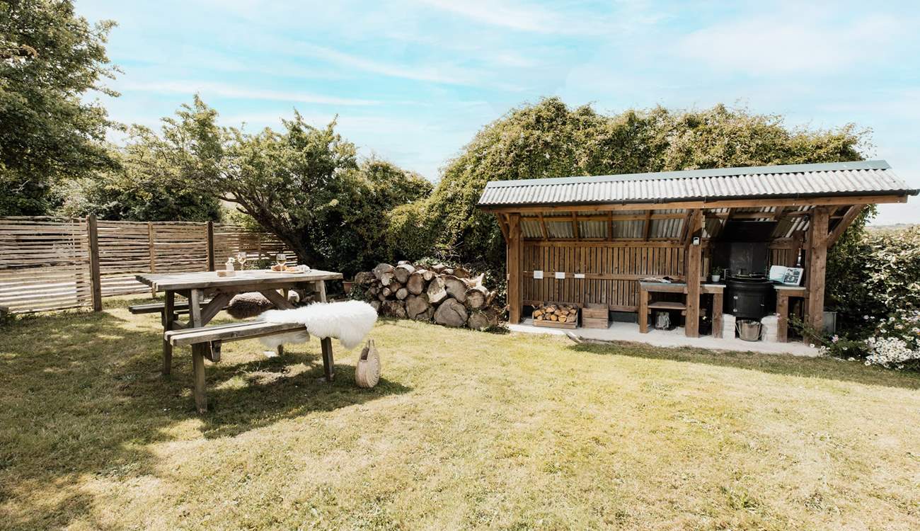The covered BBQ hut is perfect for those evening delights. 