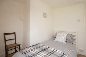 Another view of the single bedroom. It has plenty of space and looks out to the front of the cottage.