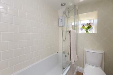 This is the bathroom with fitted shower over the bath. There is a separate WC downstairs too.