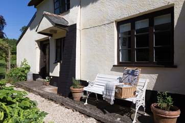 Sitting outside the front of the cottage - the gardens are to the left - is a sunspot where you can take in the setting.