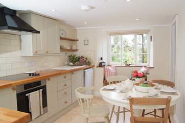 The beautifully equipped kitchen. The table extends to seat 5 guests very comfortably.