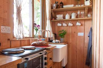A mini cooker with two ring hob is provided as your cooking appliance.